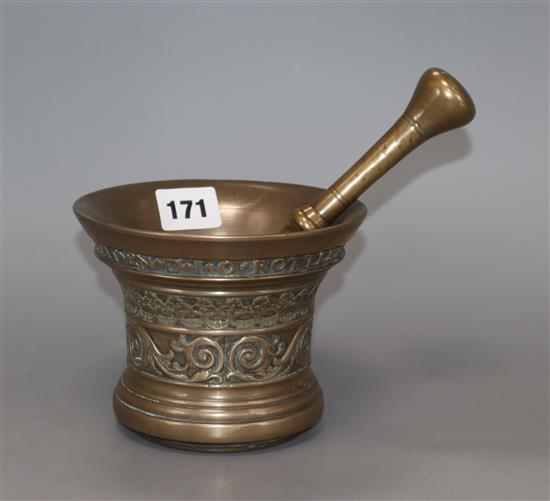 A 17th century bell metal mortar and pestle height 11cm